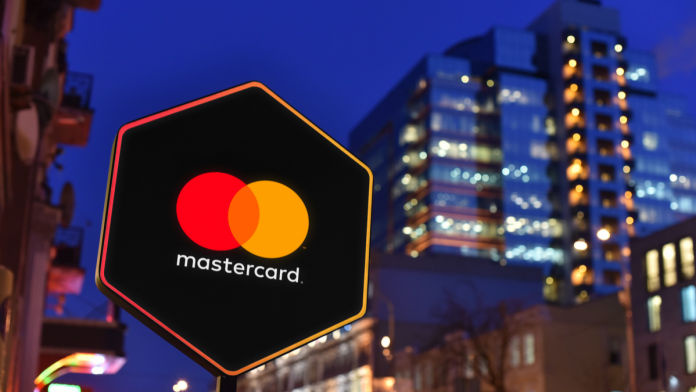 Mastercard street sign at night.