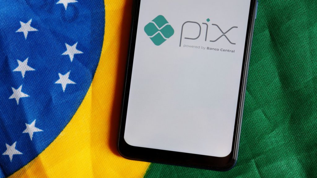 Pix logo in front of Brazilian flag.
