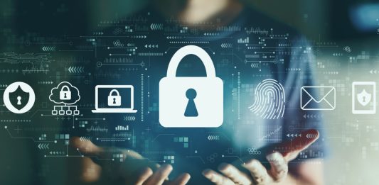 A person holding a digital lock to signify fraud protection.