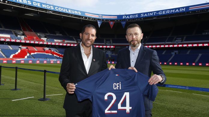 Two representatives holding a football shirt to signify a deal made by PSG and CFI.