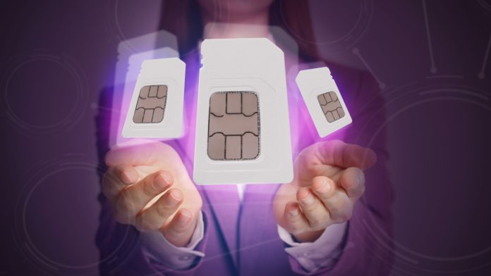 A woman holding three digitally edited SIM cards.