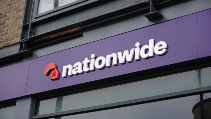 Nationwide logo and high street bank branch in UK city.