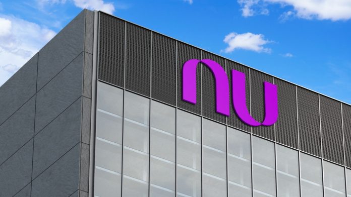 Nubank logo seen on top of the glass building.