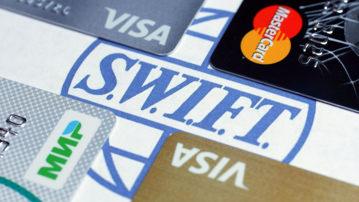 Image of the Swift logo surrounded by payment cards