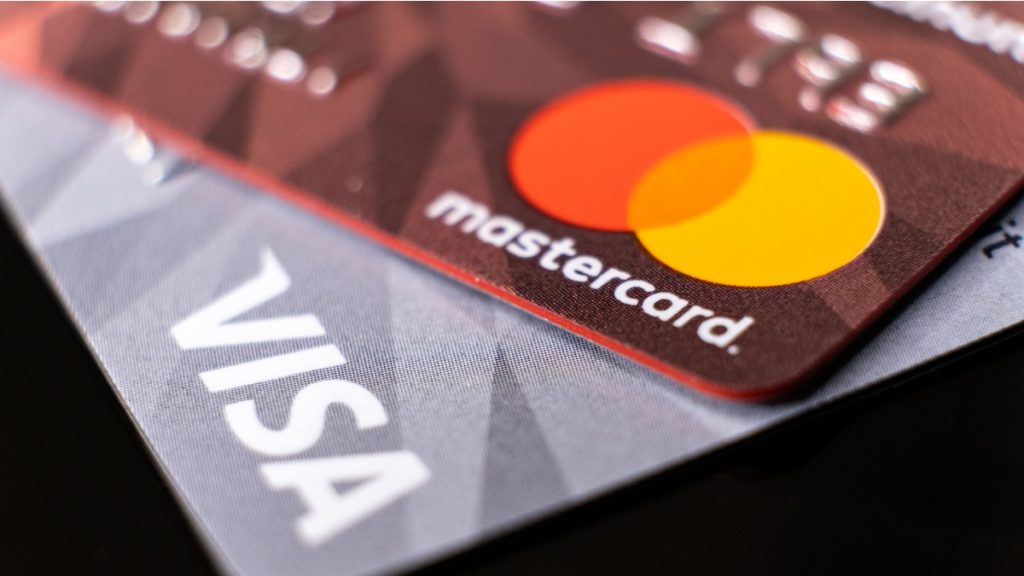 Mastercard and visa plastic electronic credit cards macro close up. ISTANBUL, TURKEY - February 2022.