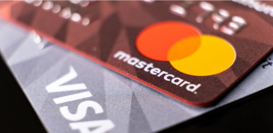 Mastercard and visa plastic electronic credit cards macro close up. ISTANBUL, TURKEY - February 2022.