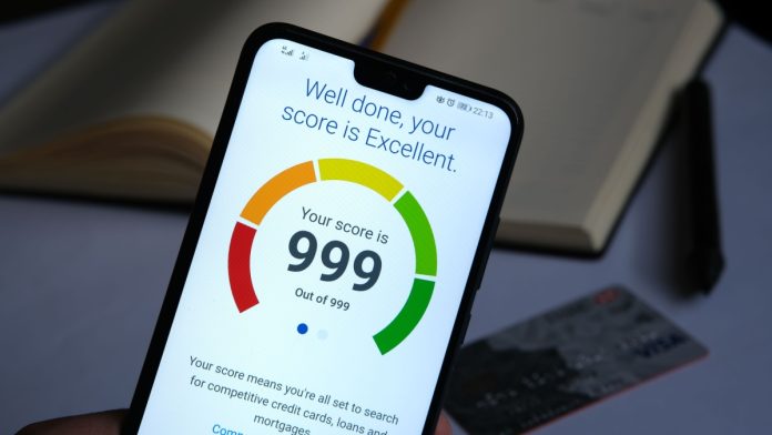 Stafford / United Kingdom - September 27 2020: Experian Credit Score report seen in the smartphone screen with the highest possible number. Real photo.