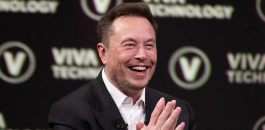 Elon Musk mid-laughter