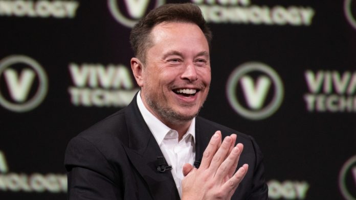 Elon Musk mid-laughter
