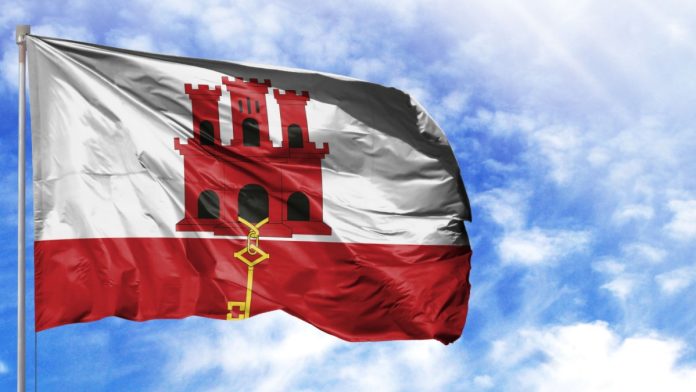 National flag of Gibraltar on a flagpole.