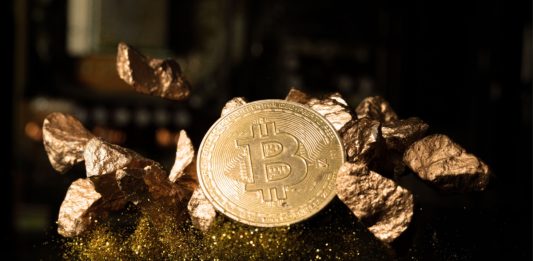 BTC bitcoin Cryptocurrency coin show on PC computer circuit motherboard and lock key for hacker. Concept for crypto currency, mining, technology, investment, finance, national bank reserve.