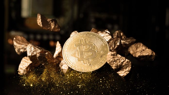 BTC bitcoin Cryptocurrency coin show on PC computer circuit motherboard and lock key for hacker. Concept for crypto currency, mining, technology, investment, finance, national bank reserve.