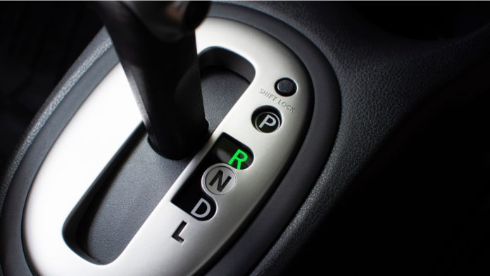 Put a gear stick into R position, (Reverse) Symbol in auto transmission car.