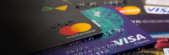 A pile of debit and credit cards following the RBA's decision to decide whether to remove card surcharges.