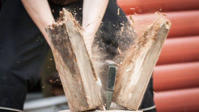 Wood chopping with hand axe.