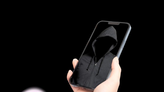 A suspicious person on the screen of a smartphone.