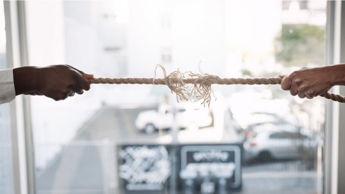 Business people, hands and pulling rope in challenge for power, professional competition or break in inequality. Tug of war, employees and opposition for leadership with struggle and battle in office