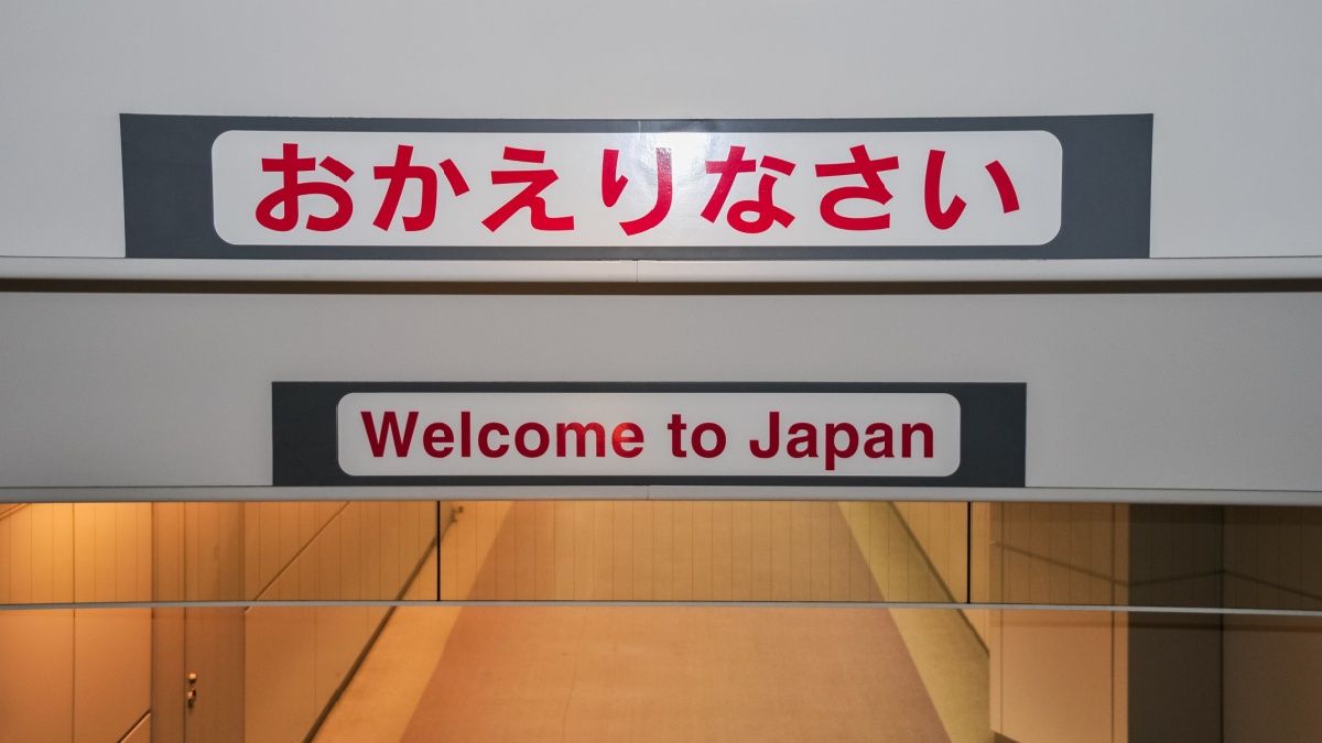 Sign saying "Welcome to Japan" in English and Japanese in Narita Airport in Tokyo, Japan.