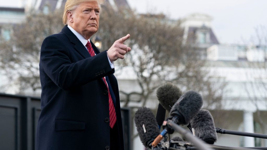 An image of Donald Trump, outside addressing members of the media