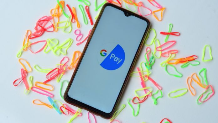 Image of a smartphone with Google Pay logo on it. Illustrating launch of Agentic Pay