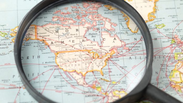 Map of North America through magnifying glass.