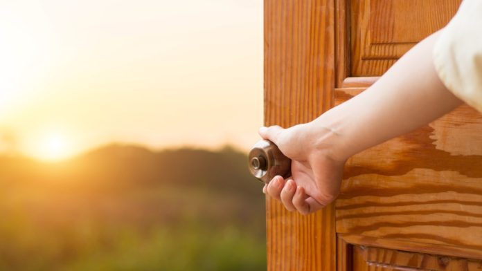 Grand opening women hand open door knob or opening the door, grand opening, Close up hand open door.