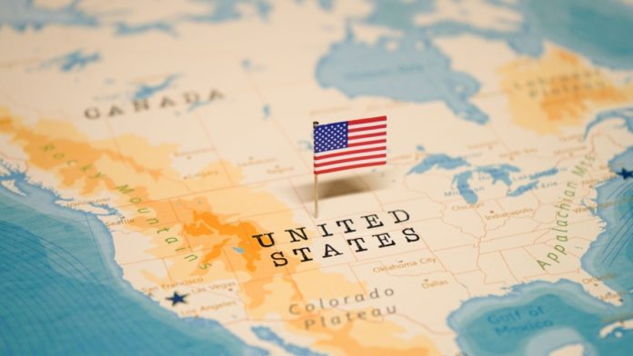 Map of the US with a flag in the centre, representing the legal battle around event contracts happening across state lines