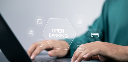 Open banking financial technology fintech concept. api financial technology, fintech. Person using laptop with open banking icon on virtual screen.