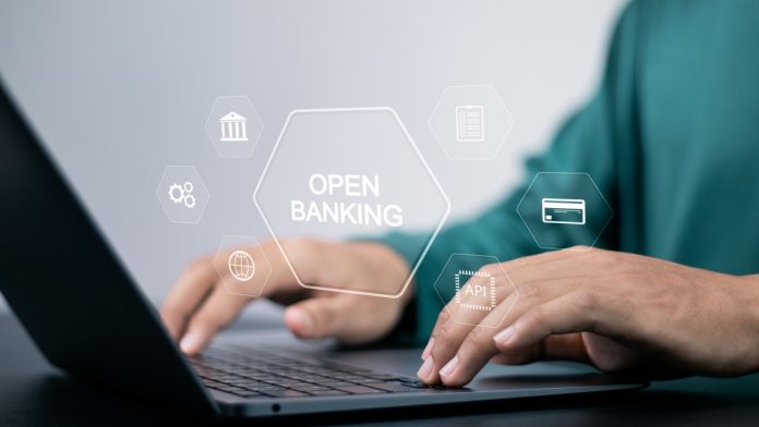 Open banking financial technology fintech concept. api financial technology, fintech. Person using laptop with open banking icon on virtual screen.