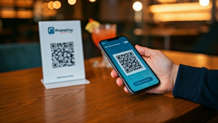 Image of a PromptPay Qr Code being scanned by a person holding a smartphone