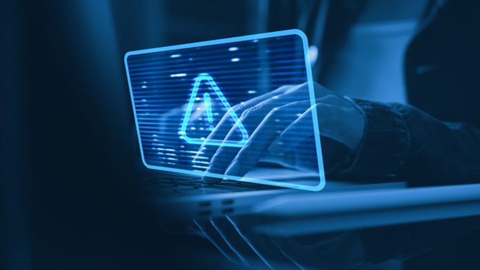Payment fraud characterized by a warning symbol on a screen