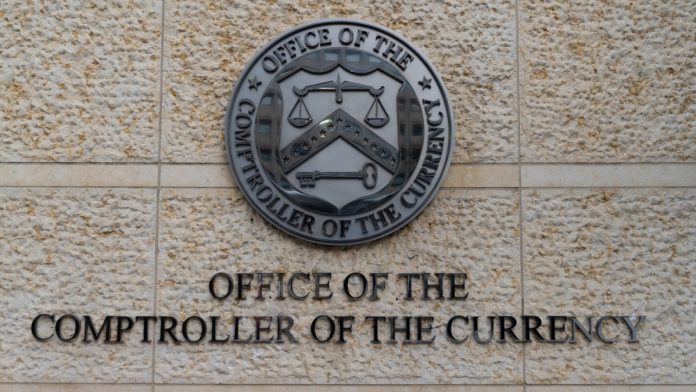 Washington, D.C., USA - February 26, 2022: Seal of the Office of the Comptroller of the Currency at Headquarters Building.