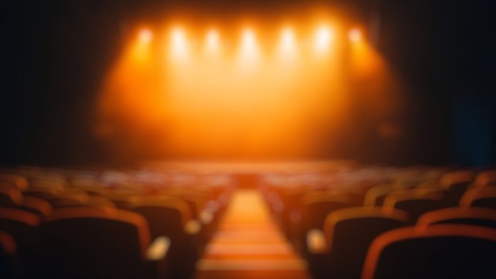 A blurred image of an empty theatre representing the question posed by Ripple and Mercado Bitcoin's recent launch