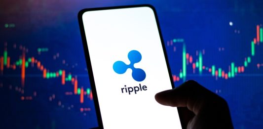 West Bangal, India - February 4, 2022 : Ripple logo on phone screen stock image, cross-border payments