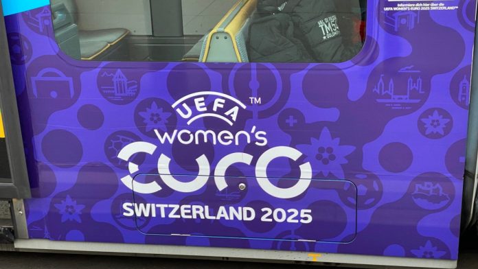 Tram with special livery Uefa Women's Euro 2025 at tram station Schwamendingerplatz on a foggy winter day. Photo taken February 2nd, 2025, Zurich, Switzerland.