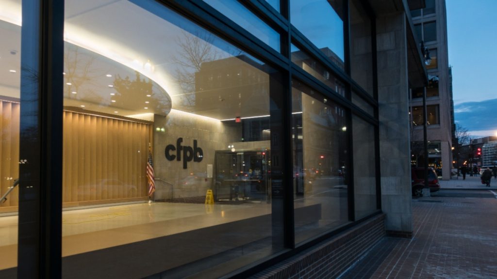 Consumer Financial Protection Bureau entrance, following overdraft fee verdict against Navy Federal amid Open Banking delay