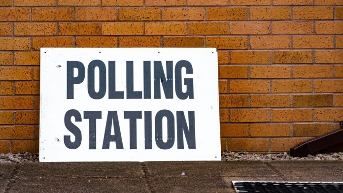 The age to vote lowered to 16 in the UK. Image of a polling station notice.