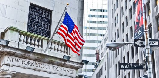 The side entrance of New York Stock Exchange and a street sign of Wall Street as CoinShares announces Nasdaq listing
