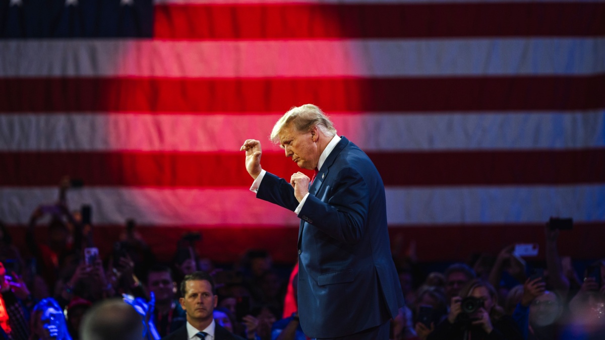 Image of Donald Trump at CPAC. He has just introduced a new H-1B visa law.
