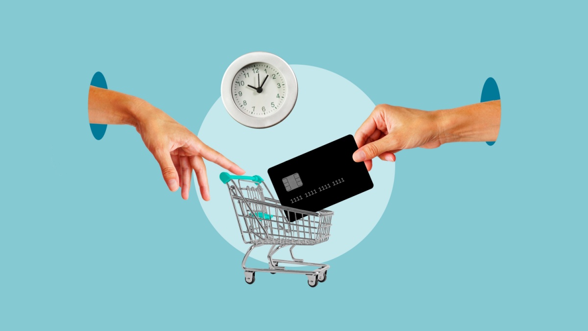 Hand with shopping cart and hand with credit card. Shopping time and buying with a credit card. Buy now pay later. Ecommerce sales and sale of goods, online trading platforms