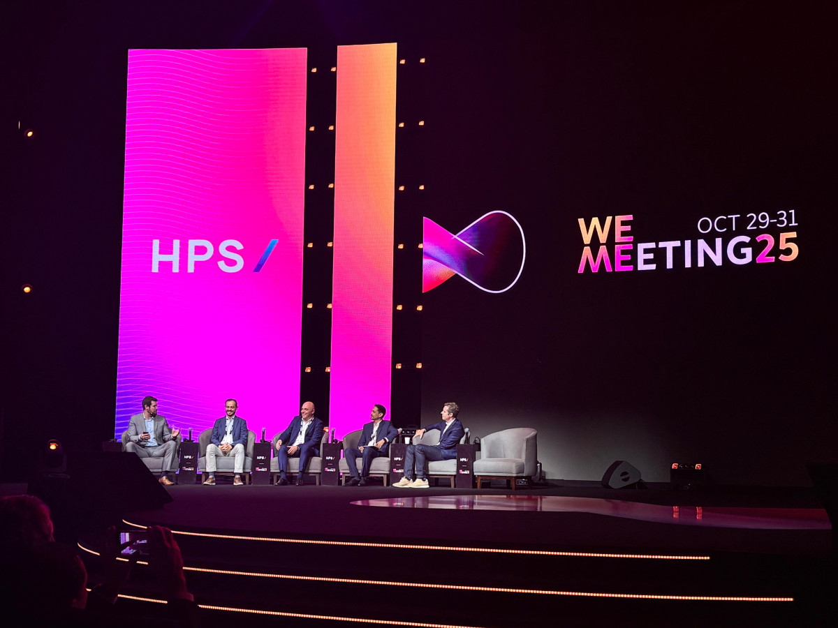 Image of panelists speaking at WEMEETING25 on CaaS.