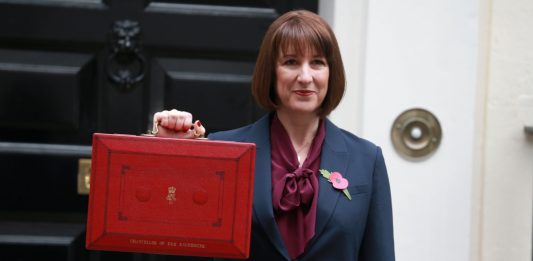 Rachel Reeves, poses outside 11 Downing Street ahead of presenting the Autumn Budget 2024