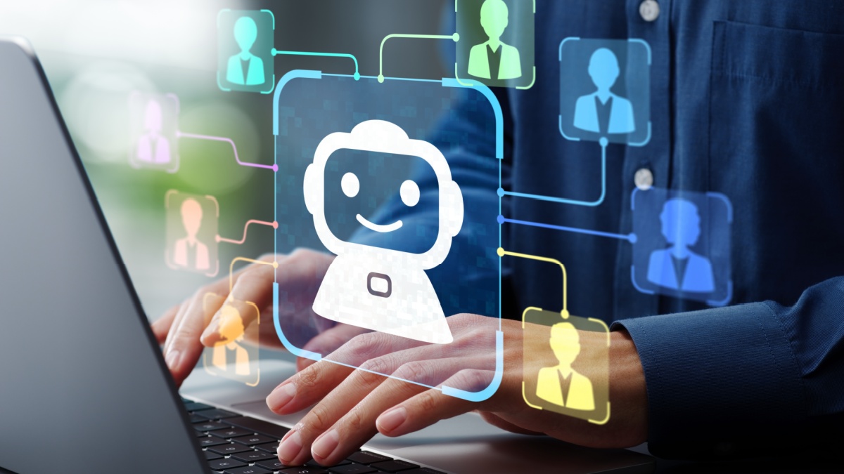 AI agent and customer support. Artificial intelligence helping and assisting customer. Man using laptop computer to ask questions to AI at desk.