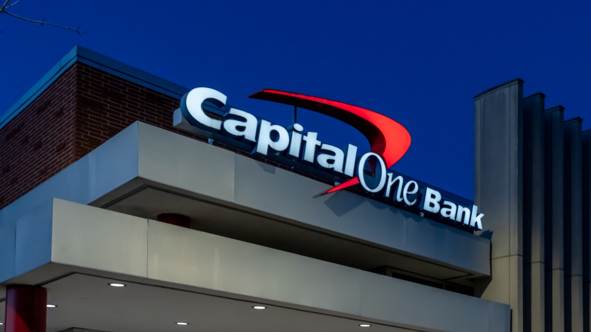 Pearland, TX, USA - April 12, 2024: Close up of Capital One sign on the building at night. Capital One Financial Corporation is an American bank holding company.