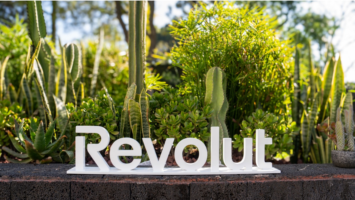 Revolut sign in front of cacti
