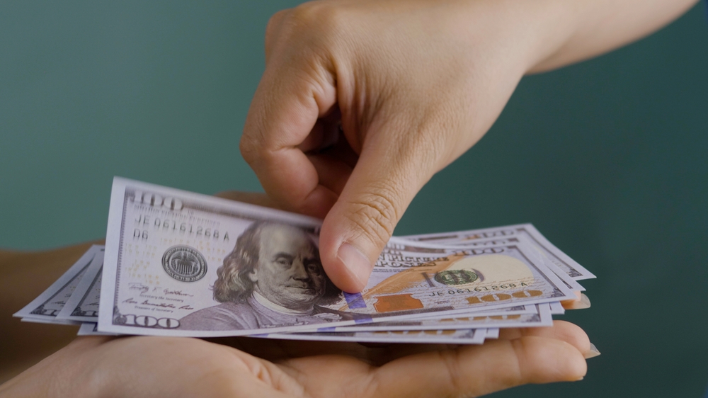 Image of US dollar bills following new york cash acceptance bill