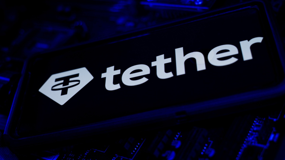 Cary, North Carolina - August 12 2025: Tether Logo on Screen on Computer CPU Stock Chart Trends and Keyboard Background