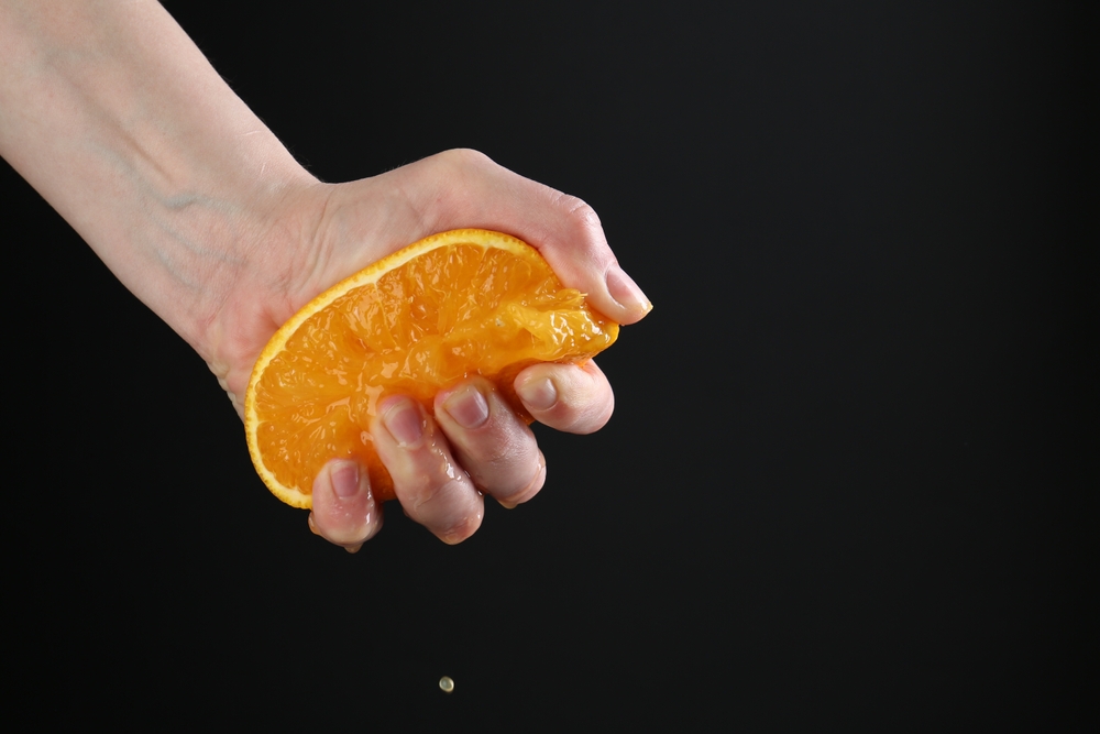 Squeezing an orange