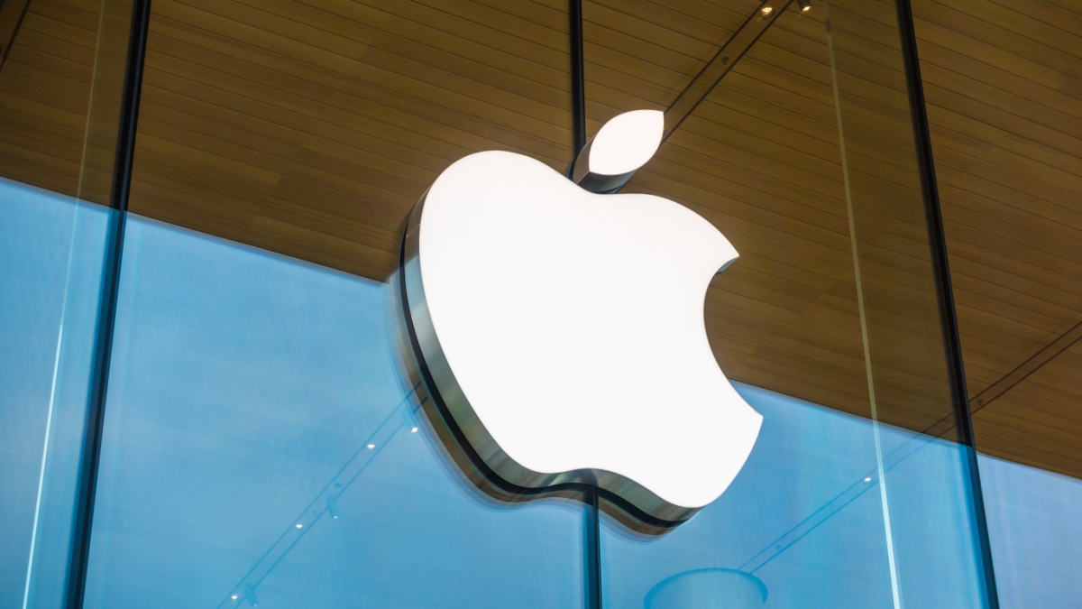 Apple logo on the window glass at a store.