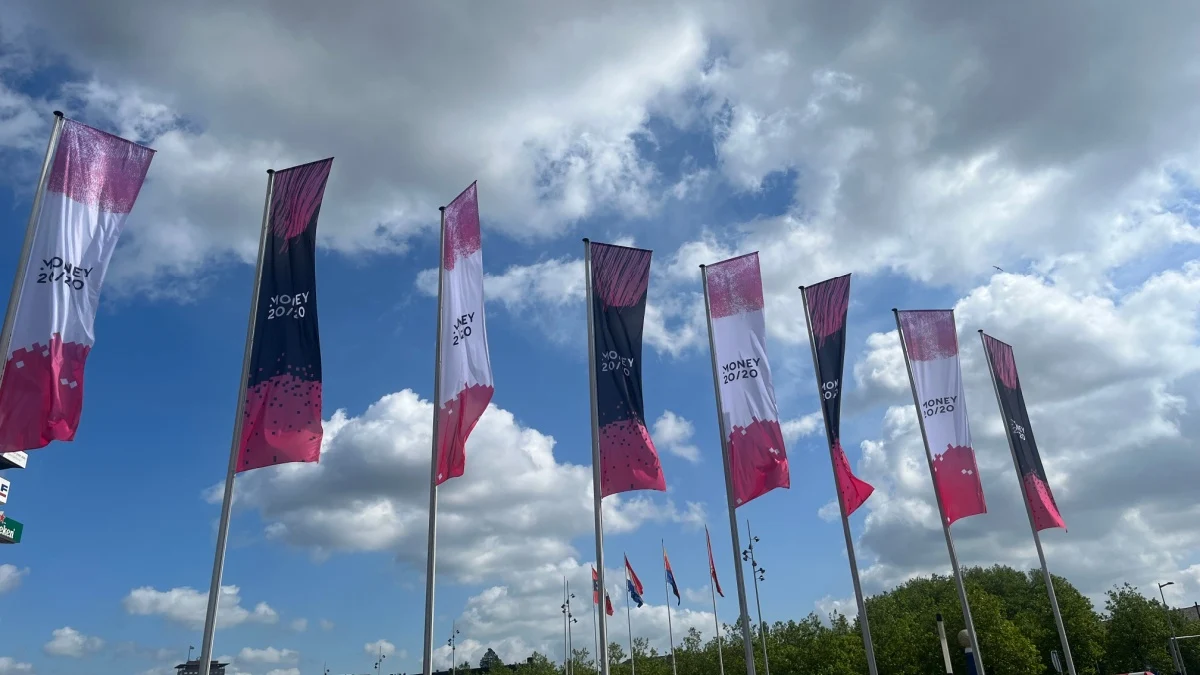 Money20/20 logos on flags outside of RAI, Amsterdam, Netherlands.